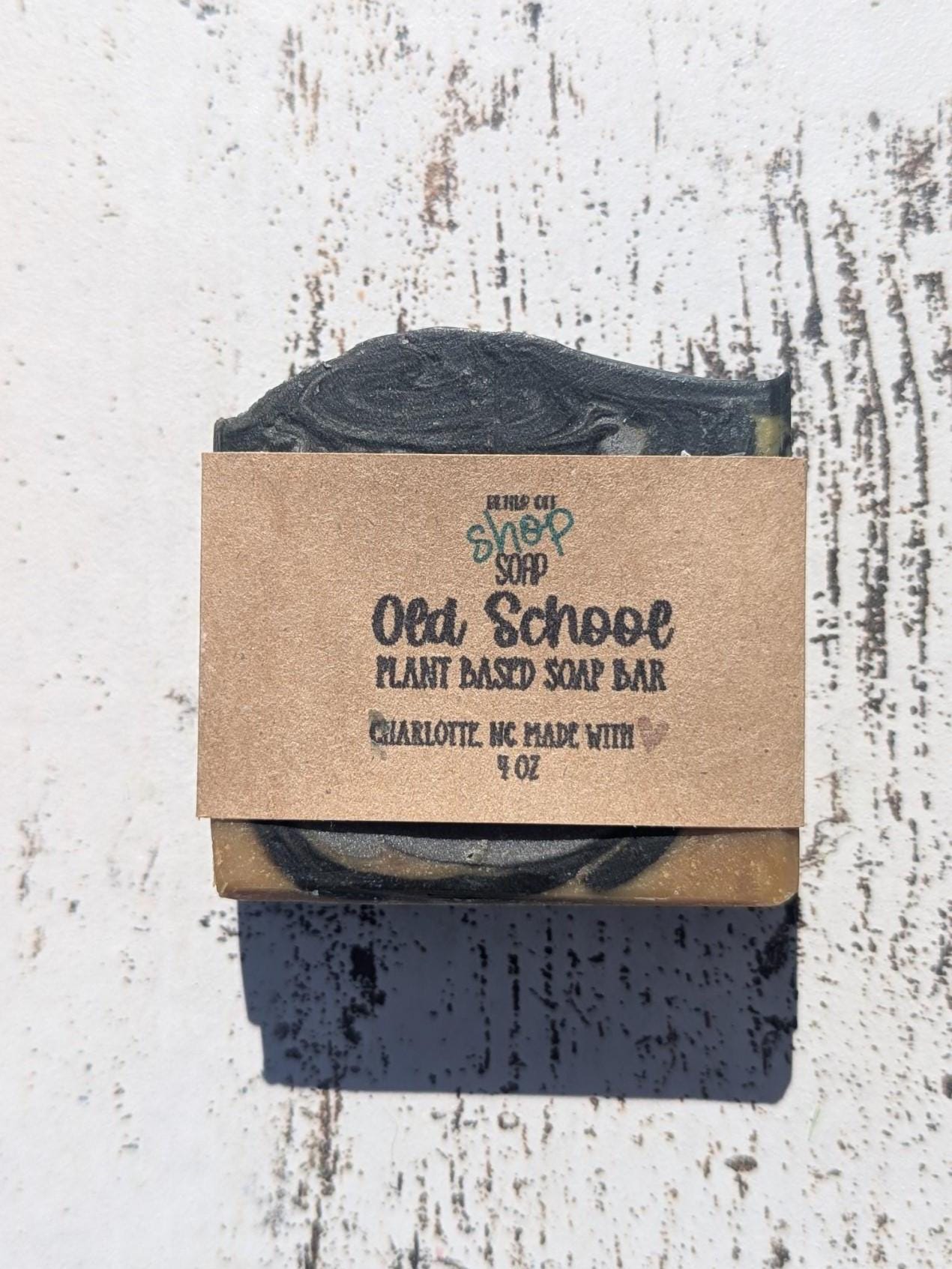 A rich brown and gray swirled Old School handmade soap bar, featuring beveled edges for a polished look.