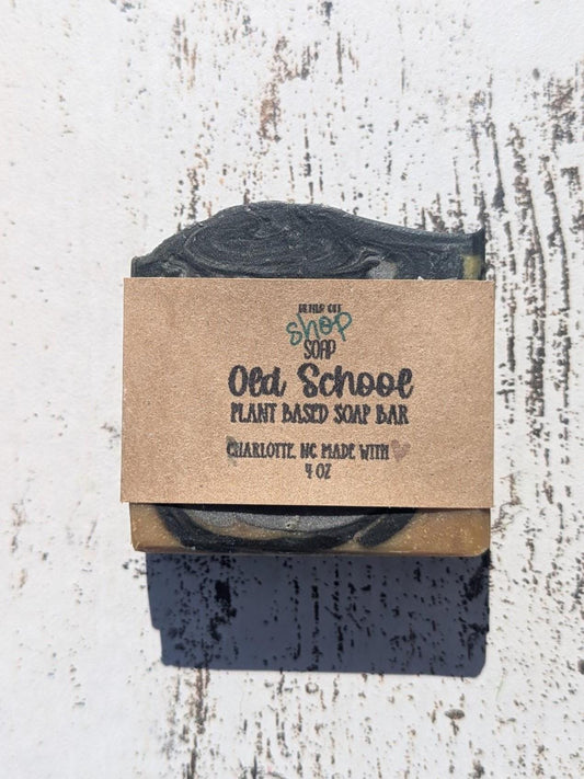 A rich brown and gray swirled Old School handmade soap bar, featuring beveled edges for a polished look.