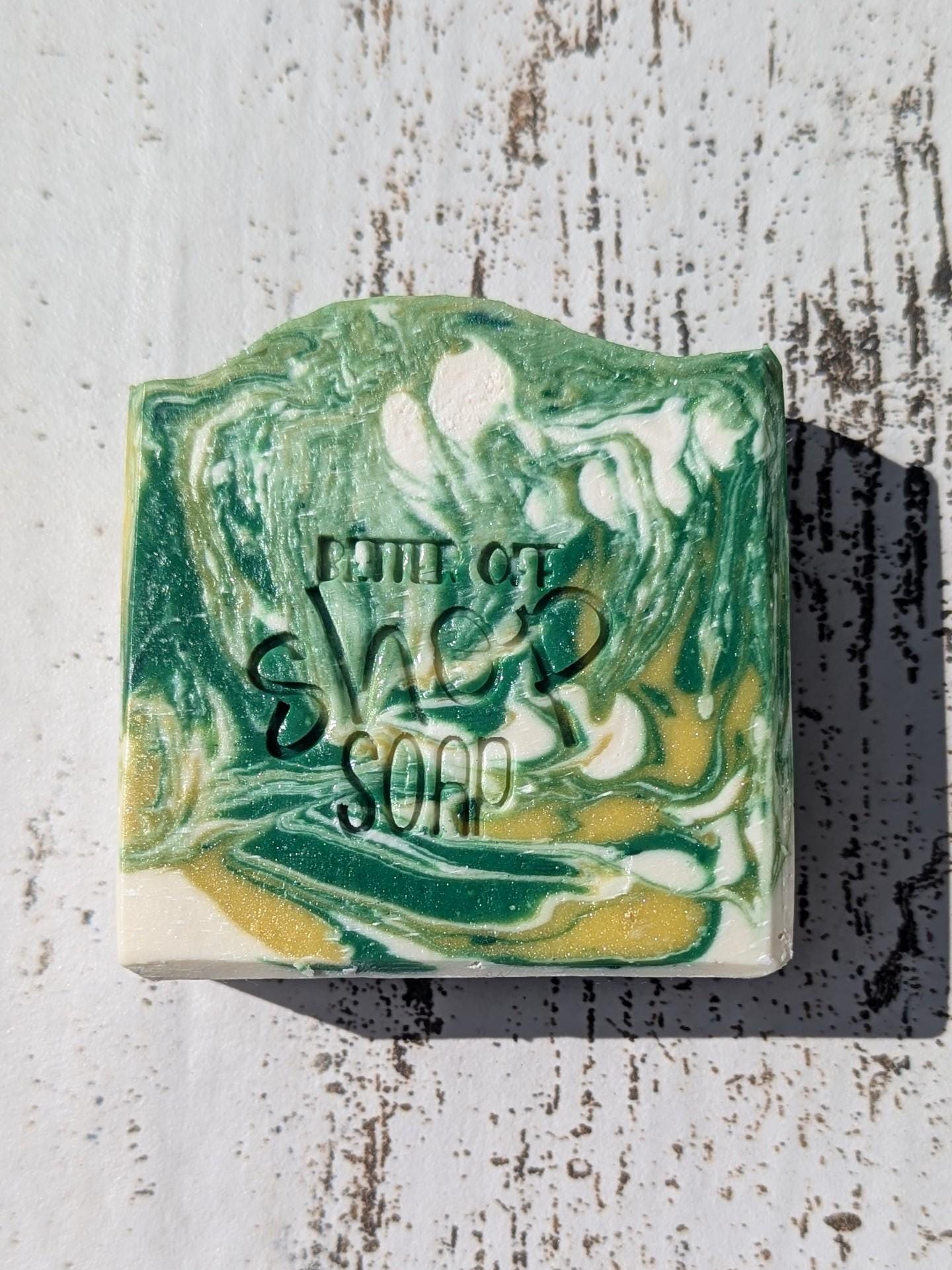 A beautifully swirled Island Time handmade soap bar, featuring green, yellow, and white tones for a tropical aesthetic.
