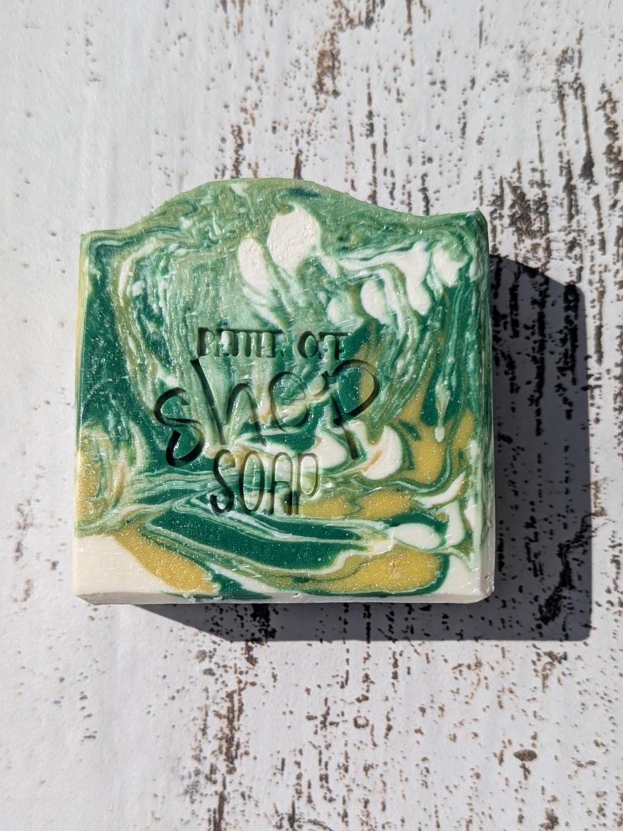 A beautifully swirled Island Time handmade soap bar, featuring green, yellow, and white tones for a tropical aesthetic.
