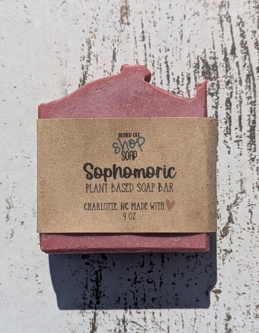 A vibrant hot pink Sophomoric handmade soap bar, featuring beveled edges for a sleek, polished look.